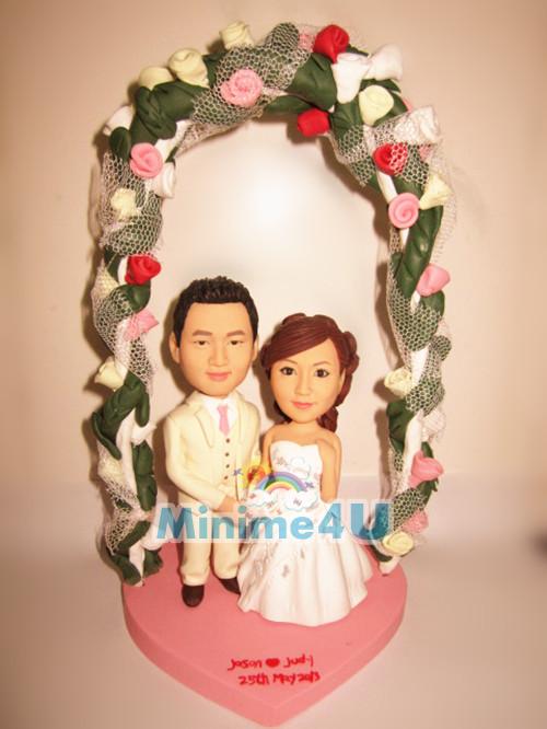 wedding cake topper with flower arch