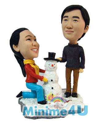 Couple are making snowman